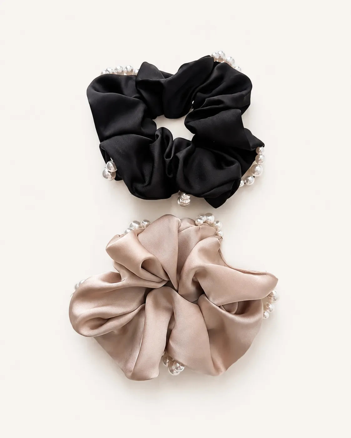 YANOVA oversized champagne and black polyester satin scrunchie adorned with delicate faux pearls for women.⁠