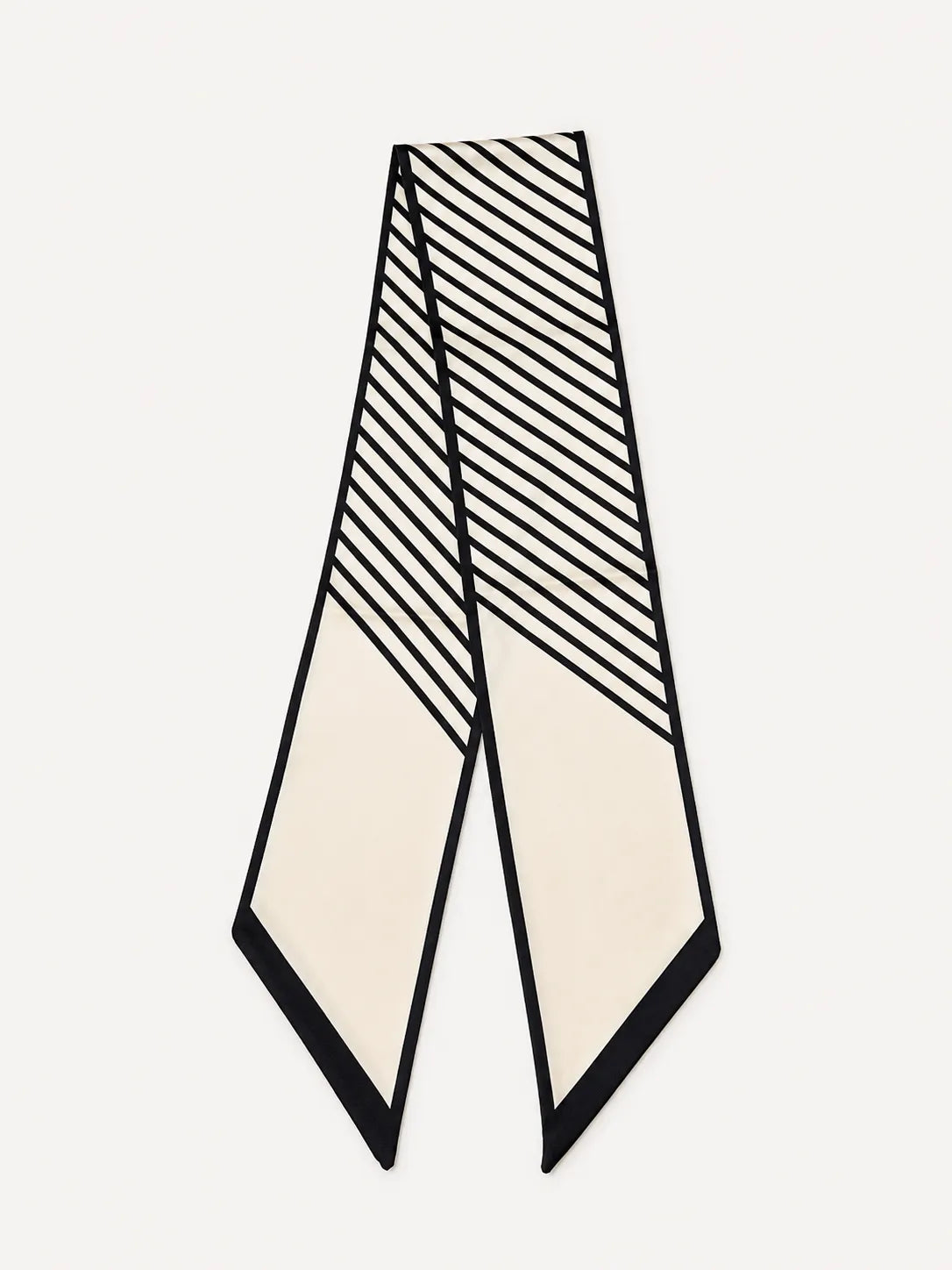 A product flat lay of an ivory satin skinny scarf featuring a modern black diagonal striped and lined pattern.